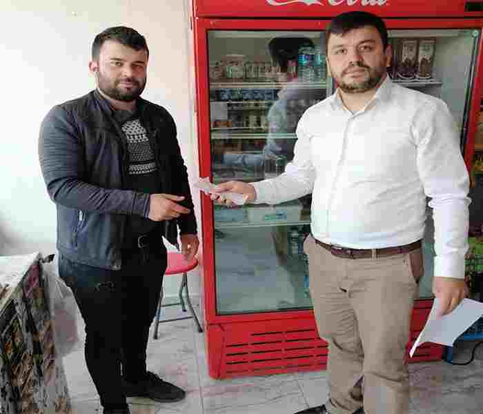 Mahallenin borcunu ödeyip veresiye defterini yaktırdı